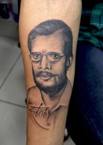 sant face tattoo